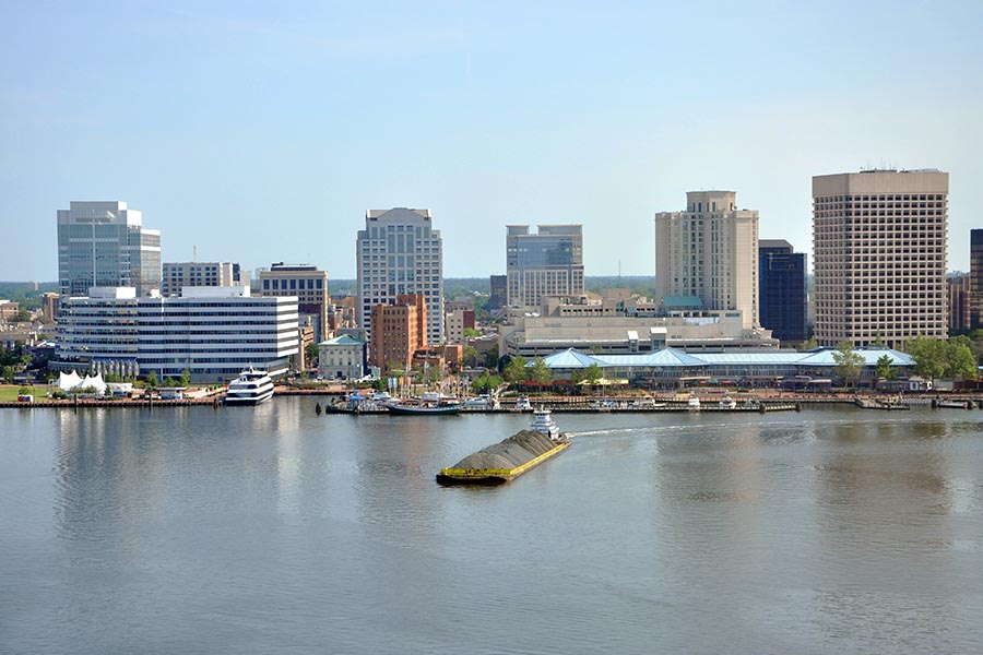 Norfolk, VA Insurance - Norfolk Skyline Along the Elizabeth River on a Cloudless Day, Boats in the Harbor