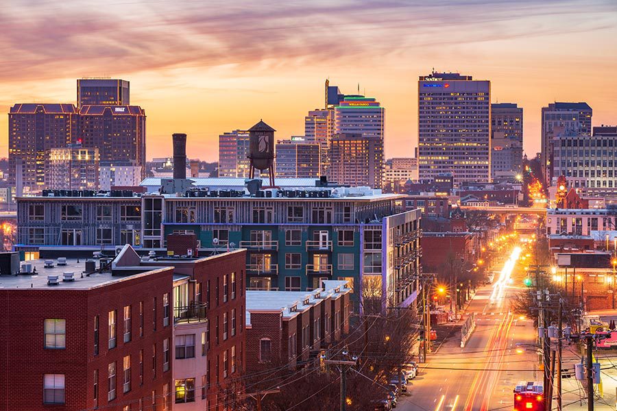 Richmond, VA Insurance - Richmond, Virginia Skyline and Busy Roads at Sunset, The City Glowing Purple and Gold
