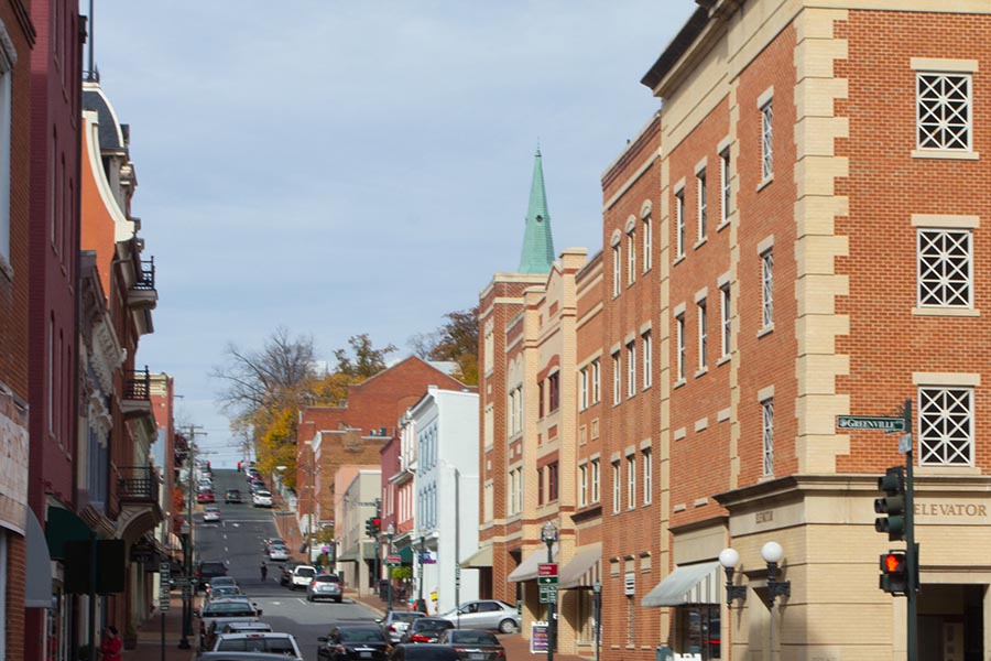Staunton, VA Insurance - Main Street in Staunton, Virginia, Brick Office Buildings and a Small Church Along the Road